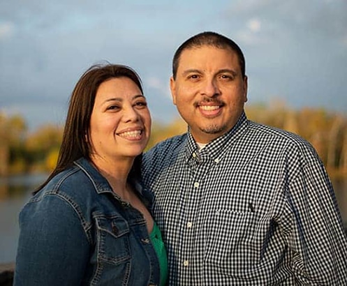 hopeful adoptive parents Chris and Irene outside